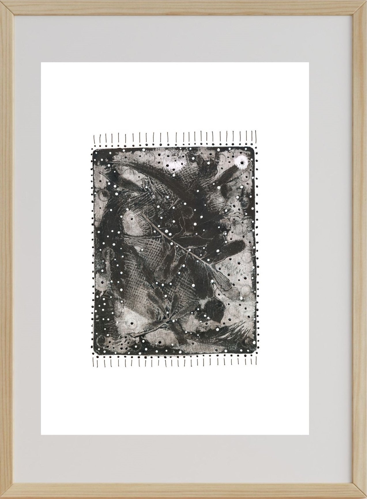 A framed artwork featuring a monochromatic print with pen, acrylic on paper, representing a bushfire ravaged landscape.