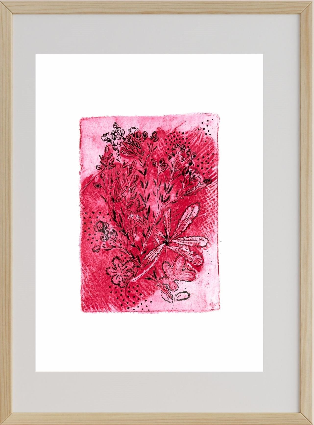 A framed artwork featuring a pink gel monoprint with floral patterns on paper.