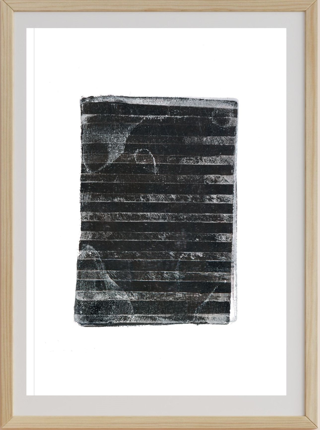 A framed artwork print depicting a black and gray striped pattern, representing burnt out lands, consistent with the description of a bushfire impact on landscape.