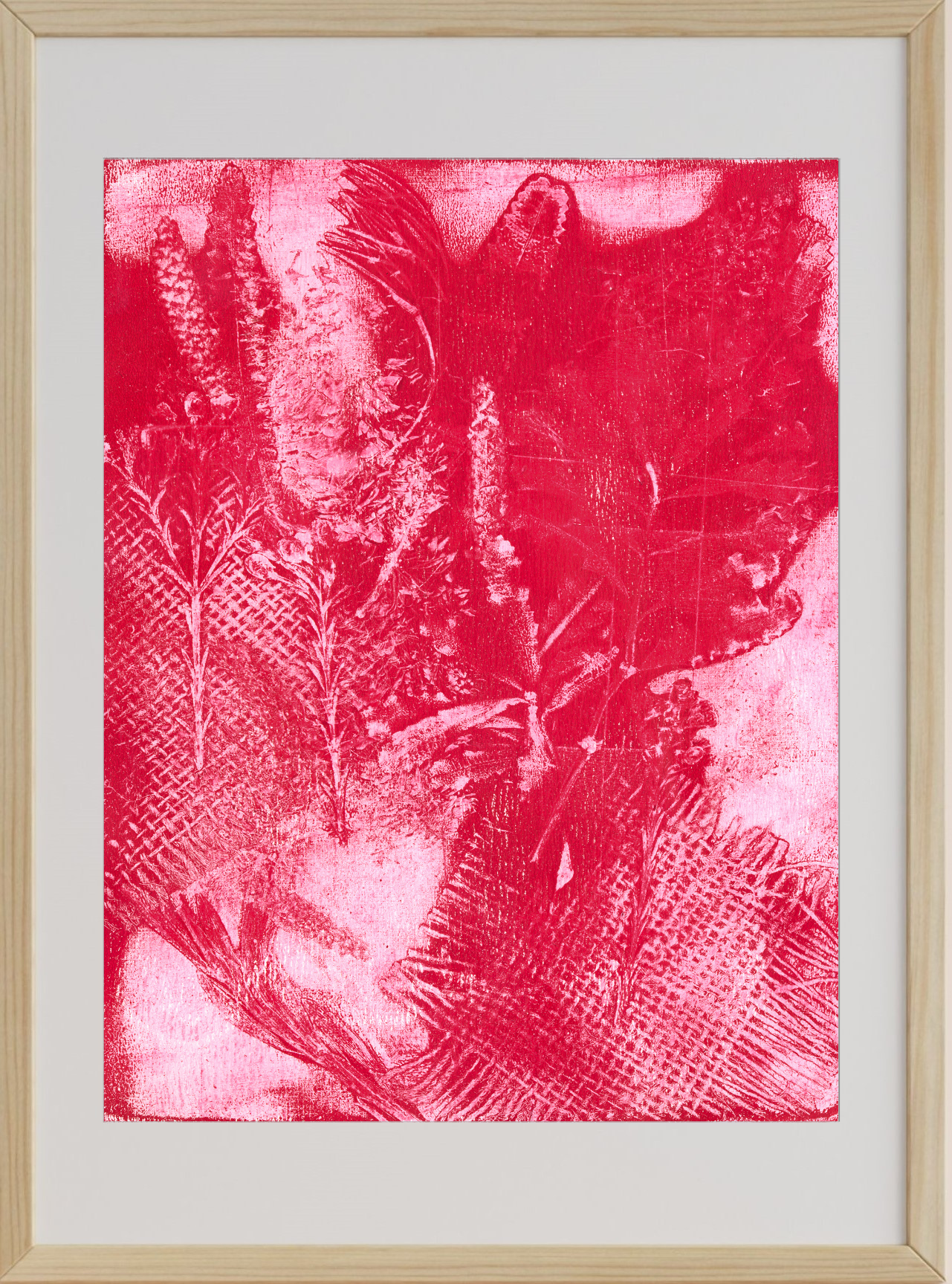Framed artwork with a red abstract design on a white background