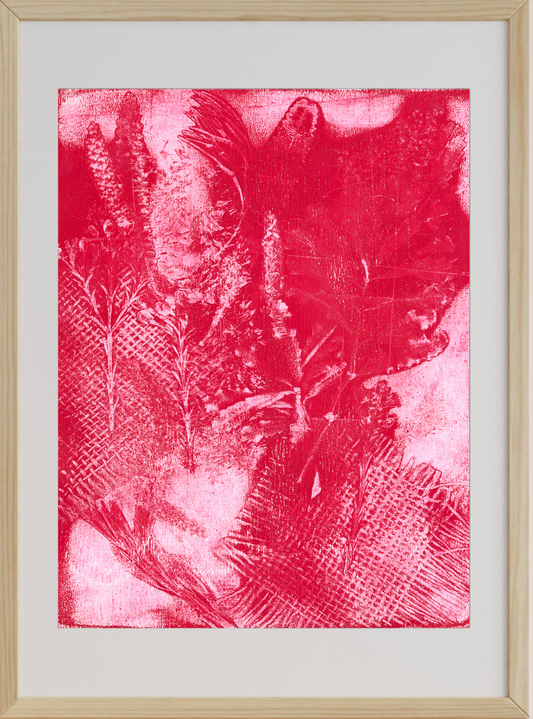 Framed artwork with a red abstract design on a white background