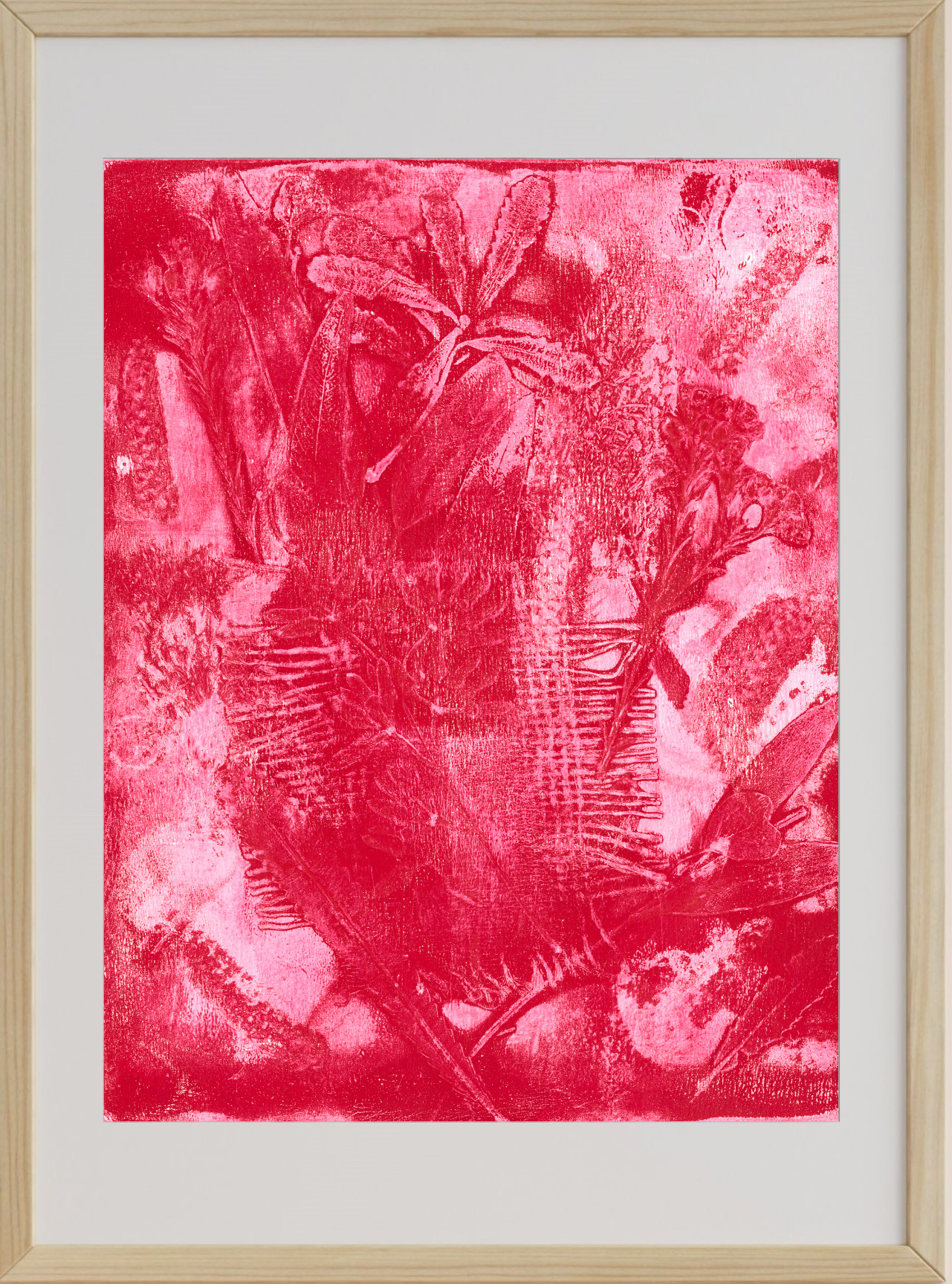 Framed artwork with a red abstract design on a white background