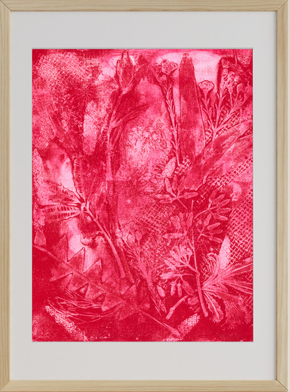 Framed artwork with a red abstract design on a white background