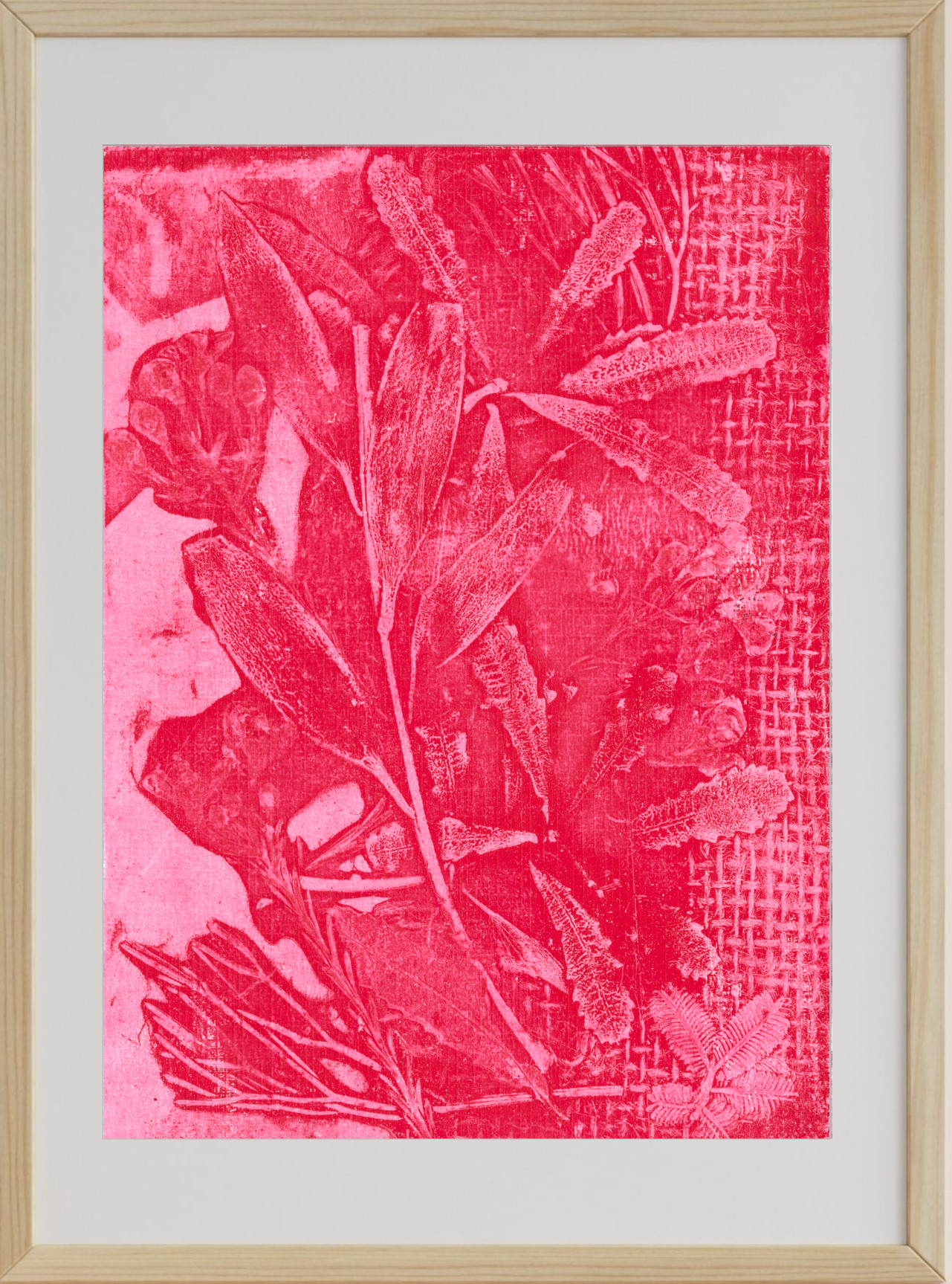 Framed artwork with pink leaf pattern on a textured background