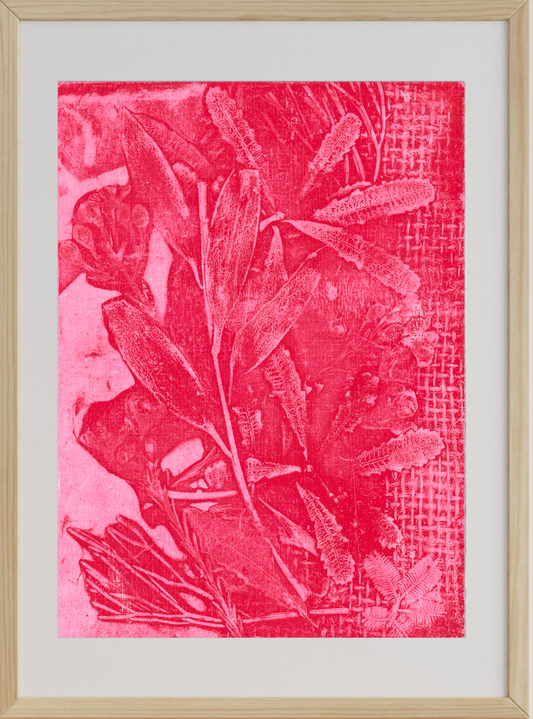 Framed artwork with pink leaf pattern on a textured background