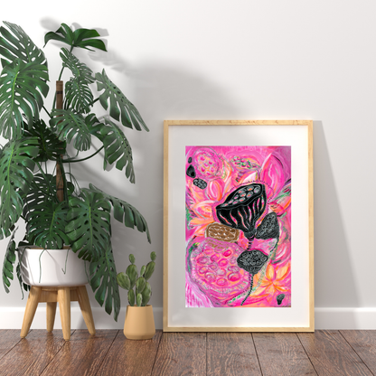 Framed abstract art piece on a wall next to a potted plant