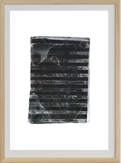 A framed artwork print depicting a black and gray striped pattern, representing burnt out lands, consistent with the description of a bushfire impact on landscape.