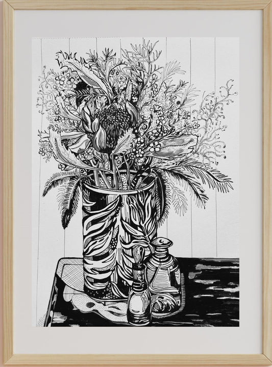 A black and white ink pen drawing of a still life scene with flowers in a vase, accompanied by a perfume bottle and foliage, set against a white background.